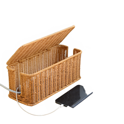 Handmade rattan wire management box for desk organization, keeping cords tidy and workspace serene.