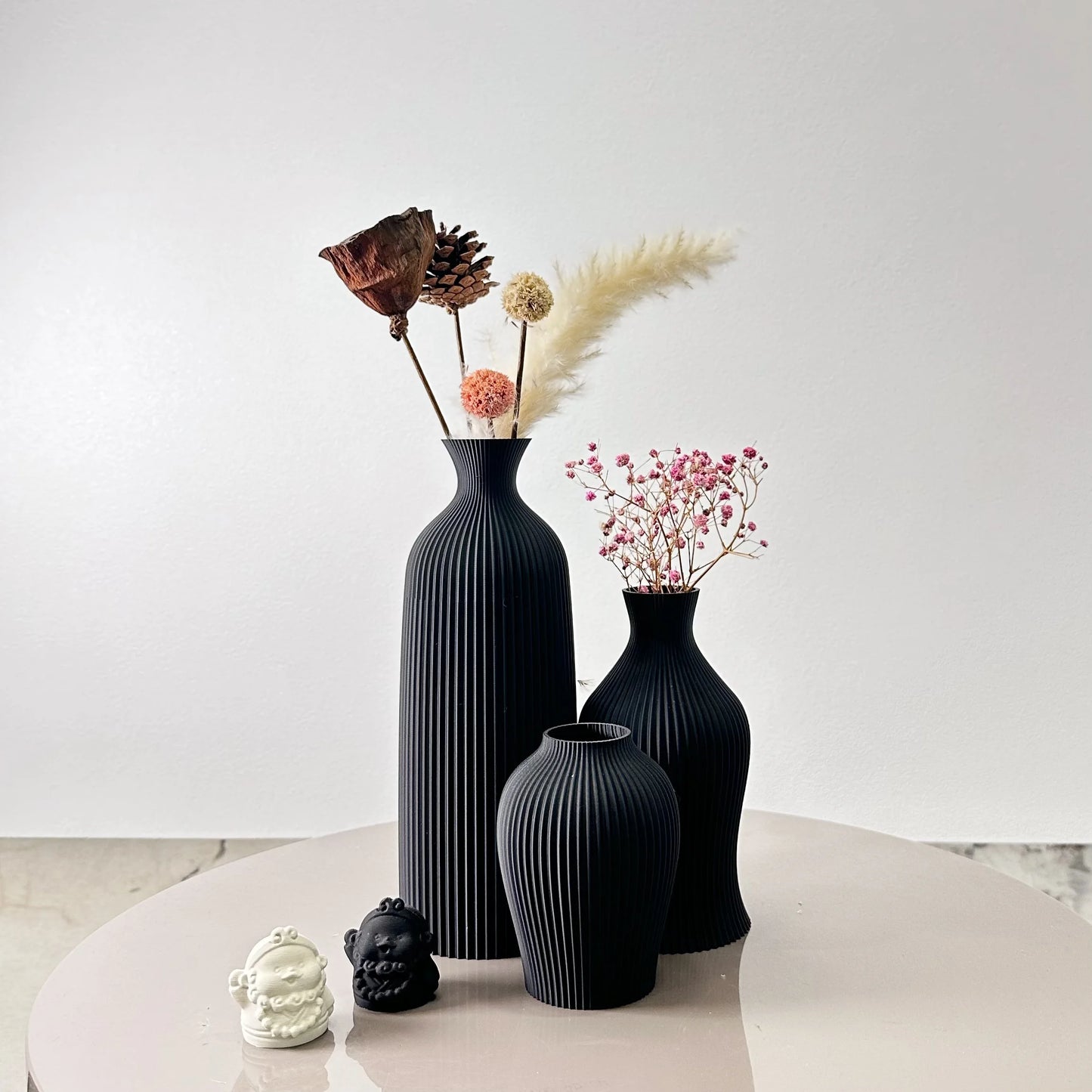 3-Piece Set of Artistic Decorative Vases Elegant Vase with decorative flowers on a stylish table.