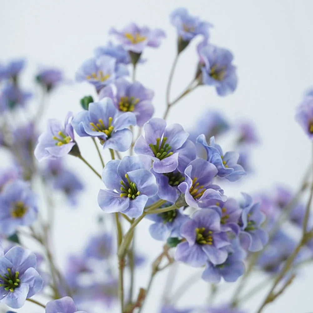 Artificial cornflower decorative flowers in vibrant violet and green arrangement for home decor.