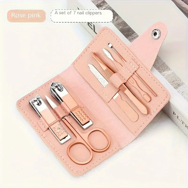Travel manicure set tools in rose pink, featuring a set of 7 nail clippers and assorted pedicure tools.