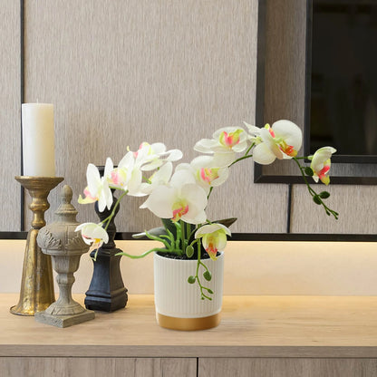 Artificial Phalaenopsis 33cm Artificial Faux Oceanic Orchid Arrangement in a decorative pot on a table.