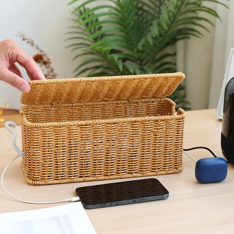 Handmade rattan cable management box with open lid, organized cords, and smartphone on desk for wire management box.