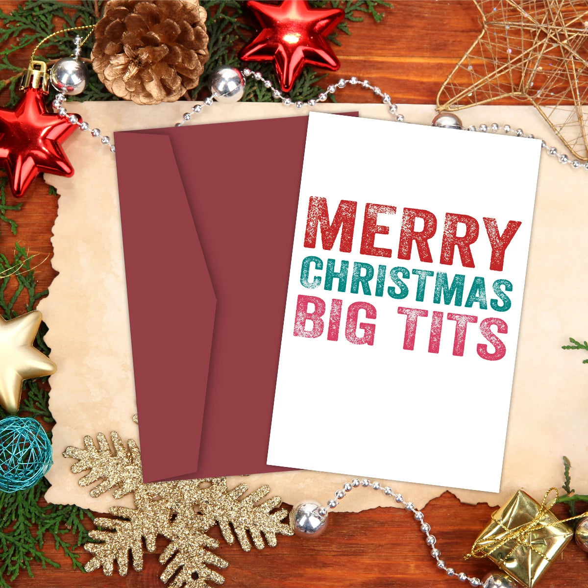 1PC Cheeky Rude Christmas CardMerry Christmas Big Tits on a festive background with Christmas decorations.