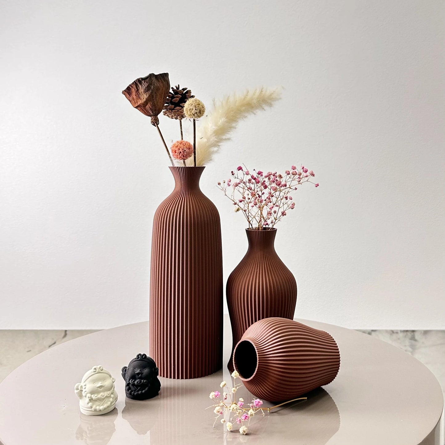 3-Piece Set of Artistic Decorative Vases Elegant Vase featuring elegant ribbed design and assorted dried flowers.